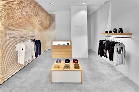 Customers are encouraged to flow freely through all the fixtures, because there are usually no defined traffic pattern in store. concrete floor » Retail Design Blog