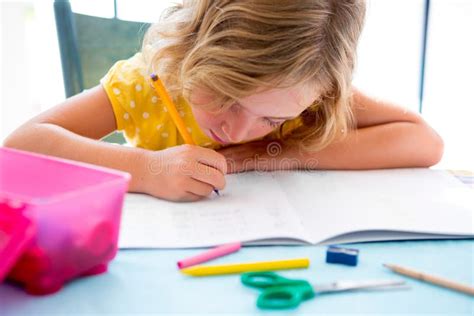 Child Student Kid Girl Writing With Homework On Desk Stock Image