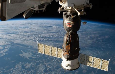 russian cosmonauts venture outside iss to inspect hole in soyuz ms 09 such tv