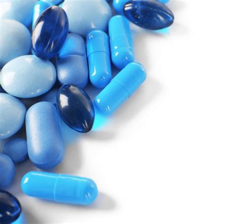 premium photo blue pills isolated on white
