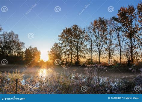 Sunrise Over A Foggy Lake On A Cold Autumn Morning Stock Image Image