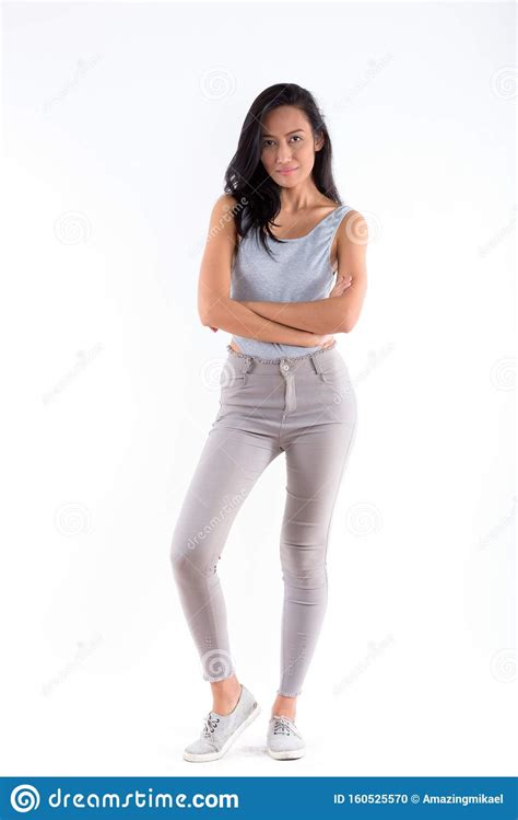 Full Body Shot Of Young Beautiful Asian Woman Posing With Arms C Stock