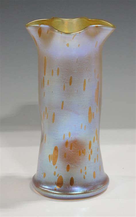 A Loetz Astraea Iridescent Glass Vase Circa 1900 The Dimpled Cylindrical Body With Pinched Rim Th