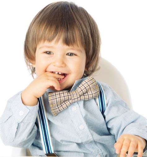 Portrait of happy little child with long blond hair outdoor. 20 hip toddler hairstyles inspiration for boys