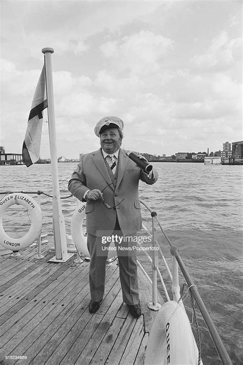 Welsh Comedian And Singer Harry Secombe Posed Holding A Telescope And