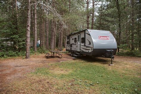Coleman Rv Sitting In A Forest Campsite In Chutes Provincial Park