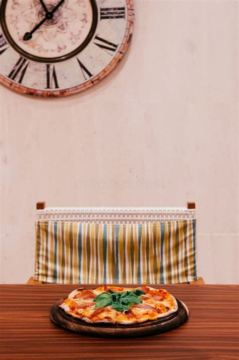 Italian Margherita Pizza On Wood Table In Dining Room Stock Image