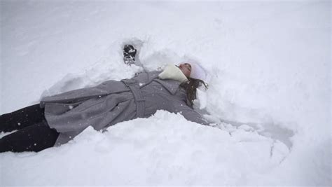 Slow Motion Young Woman Making Snow Angels Stock Footage Video 4308566
