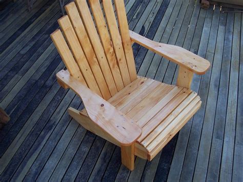 A Wooden Chair Sitting On Top Of A Wooden Deck