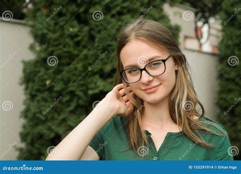 Portrait Of Cute Young Girl With Eyeglasses Smiling Blonde Hair