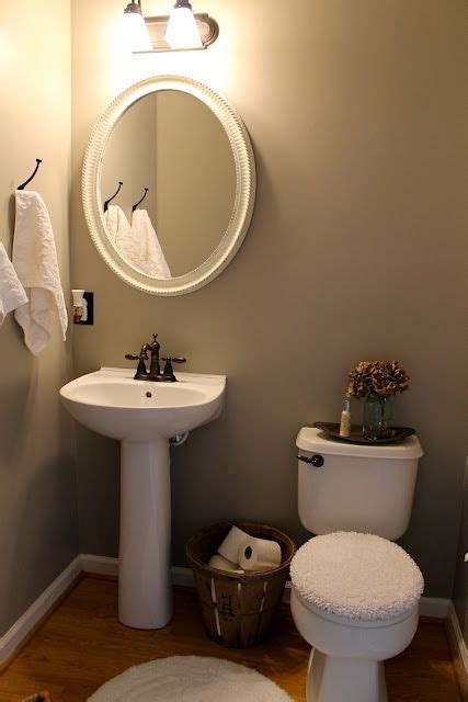 Installing a pedestal sink can help give the feeling of greater room in these small areas. Love this idea for extra toilet paper rolls in powder room ...