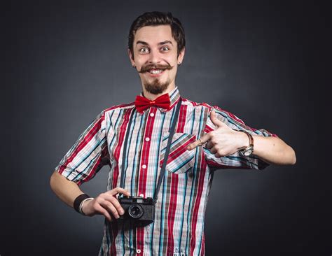 Free Photo Portrait Of A Cheerful Photographer In Studio