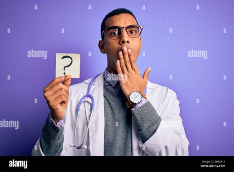Handsome African American Doctor Man Wearing Stethoscope Holding