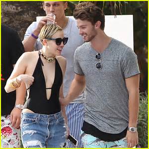 Miley Cyrus Patrick Schwarzenegger Get Flirty Poolside In Miami With Cody Simpson Cody