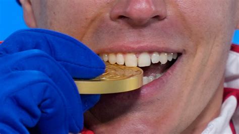 Why Do Olympic Athletes Bite Their Medals
