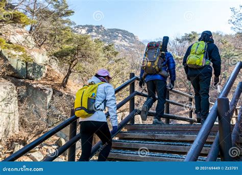 Korean Hikers Climbing The Rock At The Bukhansan Mountain National Park