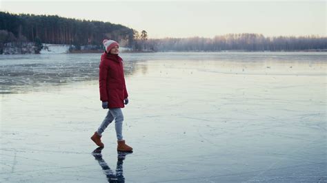 A Woman Walking On Frozen Lake Stock Footage Sbv 338972050 Storyblocks