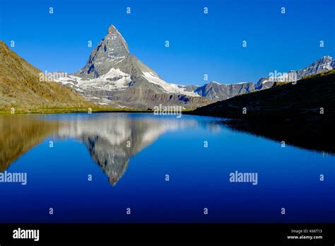 The East Face Of The Matterhorn Monte Cervino Mirroring In The Lake
