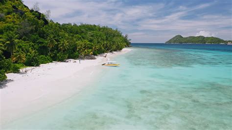 +248 264 02 82 teplova@coralstrand.sc beau vallon, box 400, mahe island, seychelles. Mahe, Seychelles exotic beach with tourist boat, blue ...