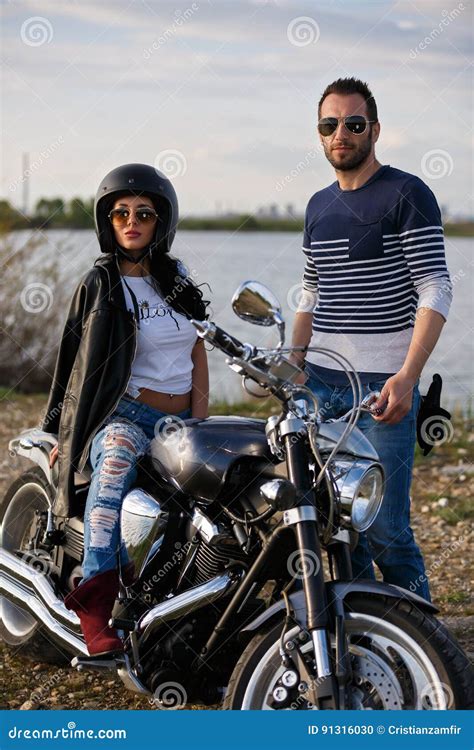 Beautiful Young Couple With A Motorcycle Stock Photo Image Of Freedom
