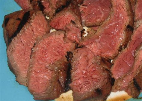 London broil is a beef dish made by broiling marinated beef, then cutting it across the grain into thin strips. Guaranteed Winner London Broil | Recipe | London broil recipes, Cooking london broil, London ...