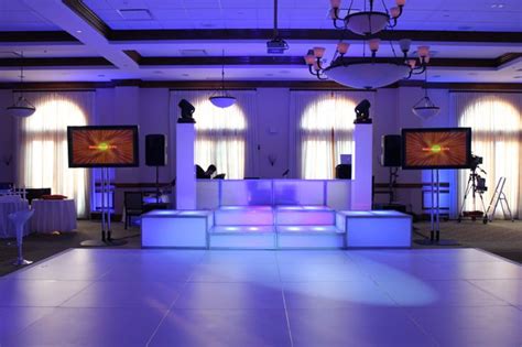 nelson cruz entertainment white dance floor and led stages led towers with monitors and moving