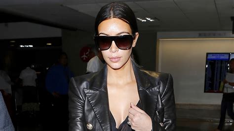 Kim Kardashian Returns From Honeymoon Flaunts Major Cleavage At Lax