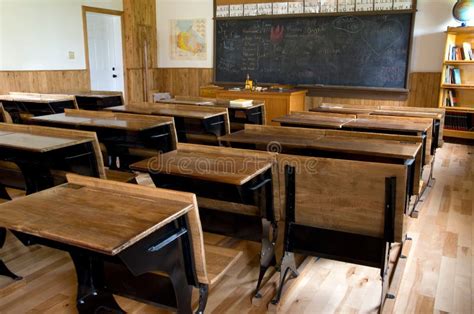 Historic School Classroom With Wooden Desks And Blackboard Stock Photo