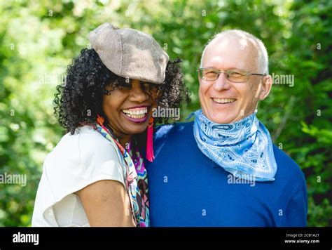 Portrait Of A Laughing Married Couple Dark Skinned Woman And Light