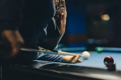 Man Playing Billiard Pool By Stocksy Contributor Ilya Stocksy