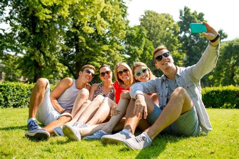 Smiling Friends With Smartphone Making Selfie Stock Image Image Of Friends Park 51885525