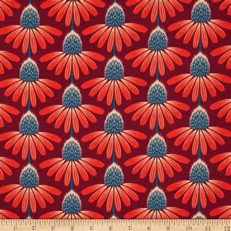 A Red And Blue Flower Pattern On A Black Background With A Ruler In The