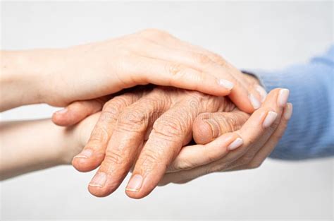 Young Hands Hold Old Hands Support For The Elderly Concept Stock Image Image Of Fingers