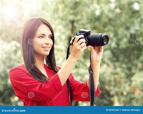 Young Beautiful Amateur Female Photographer With New Dslr Camera Stock
