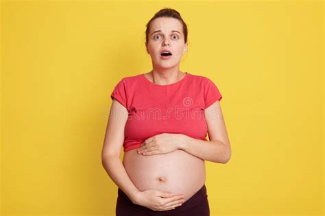 Beautiful European Woman Expecting Baby Touching Pregnant Belly Looks