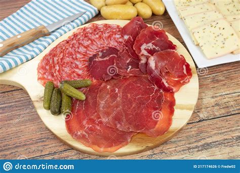 Raclette Cheese And Cold Cuts On A Table Stock Photo Image Of