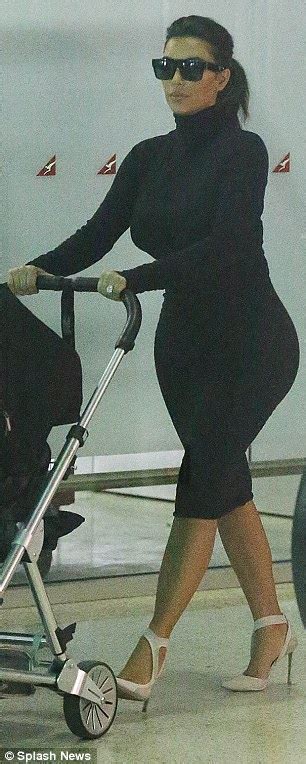 Kim Kardashian Shows Off Famous Derriere In Clingy Dress At Adelaide Airport Daily Mail Online