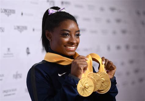 Simone biles is an american elite artistic gymnast and the world's third most honored gymnast with 30 olympic and world championship medals. Simone Biles Racks Up 'More Gold Medals Than Her Age ...