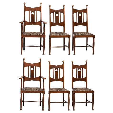 A matching pair of arts and crafts oak armchairs, c1900. Set of (6) Arts and Crafts Oak Dining Chairs, England ...