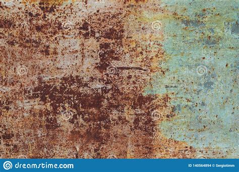 Background From An Old Rusty Sheet Of Metal With Faded Shabby Peeling