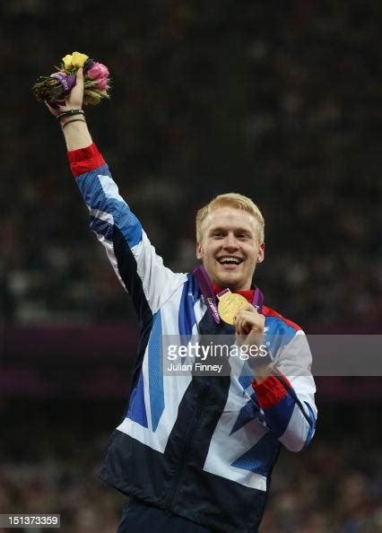 Gold Medalist Jonnie Peacock Of Great Britain Poses On The Podium