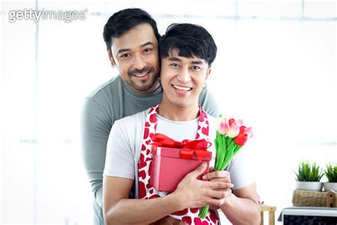 Happy Smiling Lgbt Couple Hug And Share Sweet Moment Together On Valentine Day At Kitchen Asian