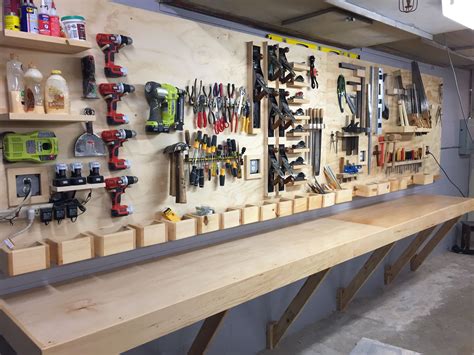 tool rack and floating workbench for a high school woodshop workbench plans diy diy garage