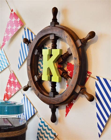 The bright yellow walls are checked with muted colors along the racetrack to simulate the cheering fans and is offset with the darker border by the ceiling. Preppy Neverland Pirate Party // Hostess with the Mostess ...
