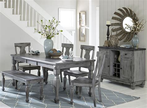 A dining room table and chairs may regularly sit four or six people, but what happens when it's your turn to host a holiday dinner? Fulbright Gray Rub Through Extendable Dining Room Set from ...