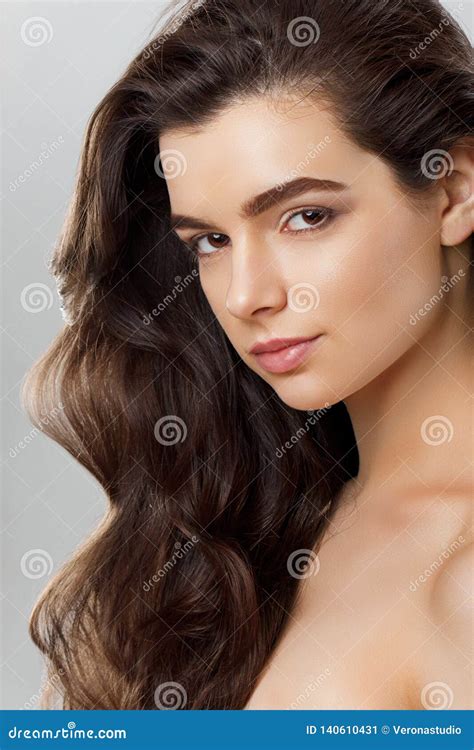 Beautiful Girl With Long Wavy And Shiny Hair Brunette Woman With Curly Hairstyle Stock Image