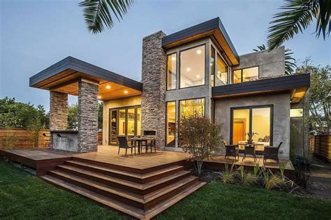 Concrete And Rough Stone Facade For Two Story Modern Home