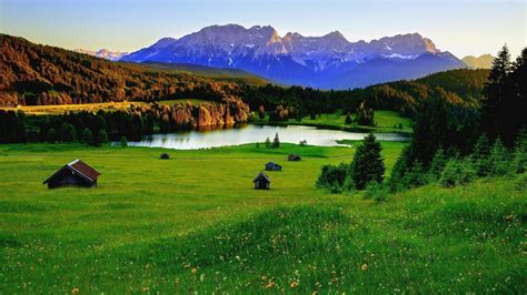 Hills With Green Grass And House In Background Of Mountain And Sky Hd