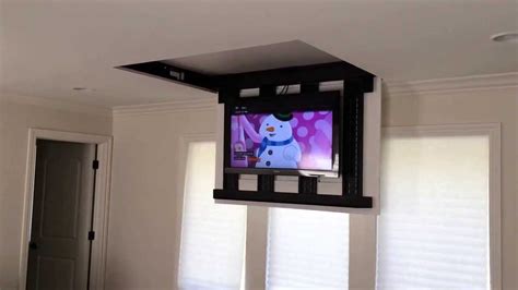 When reading the description of ceiling mounts, note how much the actual mount weighs and what size and weight tv it will support. Motorized fully automated Flip-down ceiling TV lift 46"-60 ...