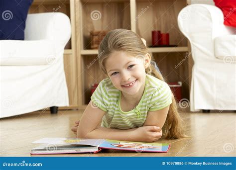 Young Girl Reading Book At Home Stock Photo Image Of Sitting